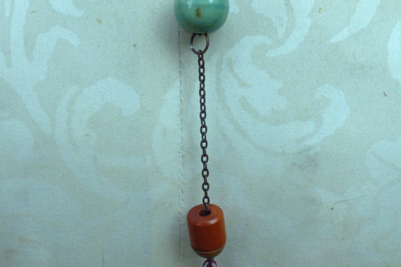 red suede chain, baubles to back Looking glass mannequin bust steel wire red suede necklace