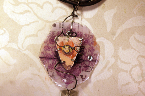 Resin coated paper and metal cage Caged circus resin necklace with a vintage crystal and leather