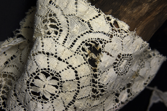 vintage lace slightly tattered Day of the Dead skully with pink flower eye