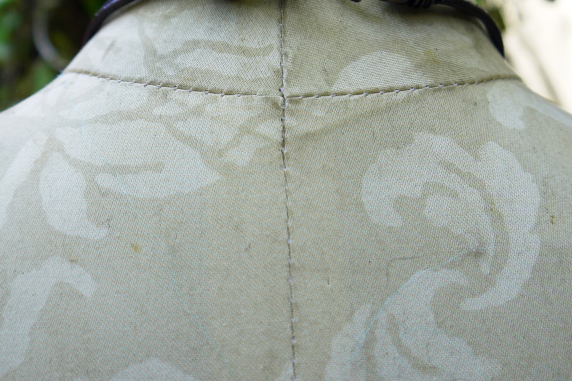 back hook closure, green bead accent Chunky relics and ruins orange tone concrete shard necklace