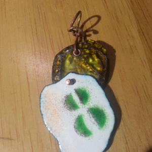 Enamel work and a recycled bottle cap 